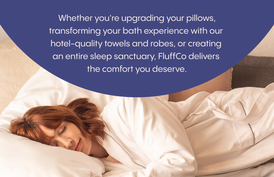 A person with reddish hair lies on a white bed with white bedding, resting on a pillow with eyes closed. A large dark blue semicircular banner at the ...